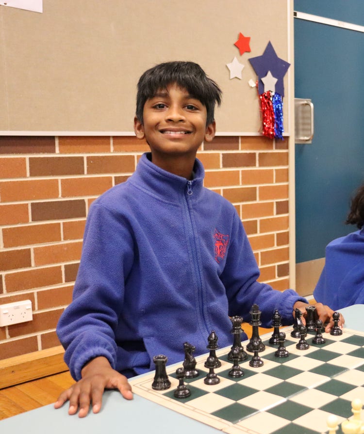 A student enjoring a game of chess.