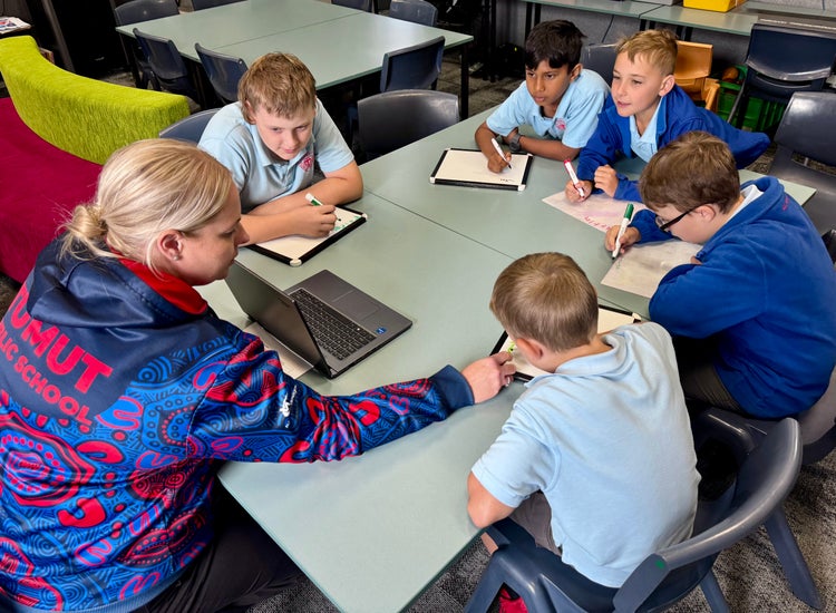 SLSO helping students in small group tuitions.