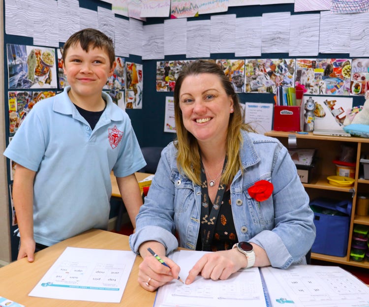 SLSO helping a student with their learning.