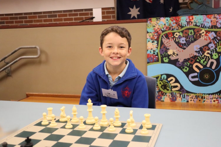 Student participating in the zone level chess tournament.