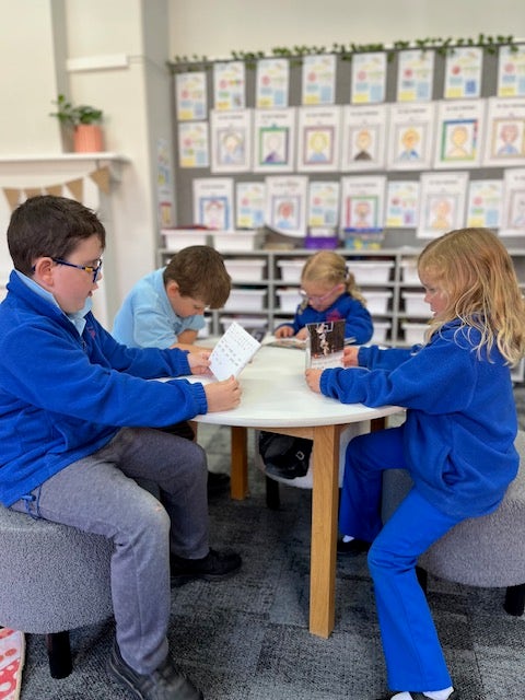 Students writing in class.