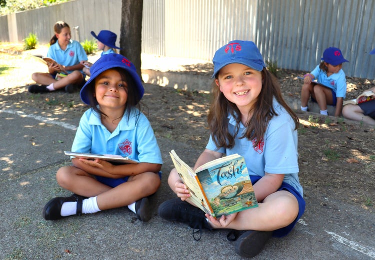 Students reading outside.
