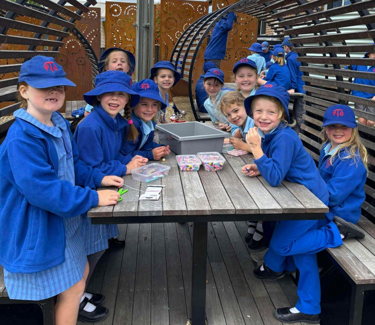 Students eating their lunch in the playground pods.