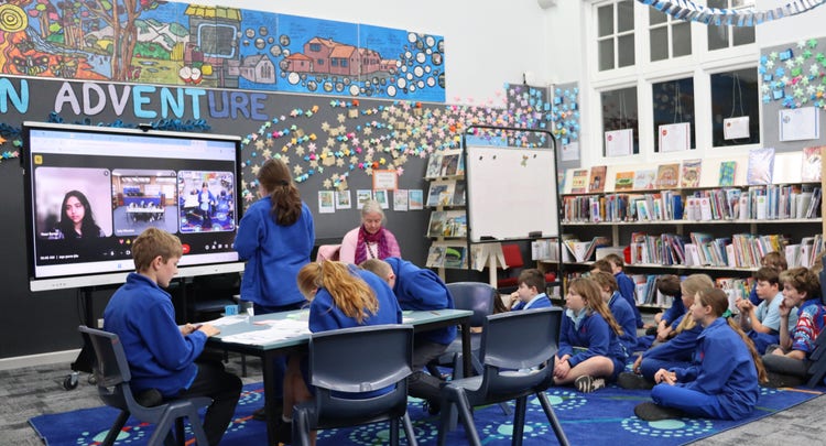 Students engaged in debating in the library.