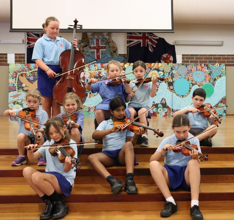 Students playing musical intruments in school band.