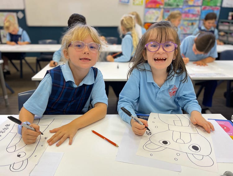 Students drawing in class.